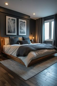 a large bed sitting in a bedroom next to two pictures on the wall above it