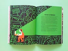 an open book with green and black designs on it