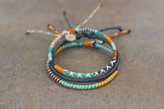 Includes 3 bracelets 1 dark blue wrap bracelet 2 multicolor wrap bracelets Adjustable from 15cm Cute Friendship Bracelets, Embroidery Bracelets, Friendship Bracelets Designs, Diy Friendship Bracelets Patterns, Bracelet Couple, Diy Bracelets Patterns, Diy Bracelet Designs, Bead Ideas, Friendship Bracelets Diy