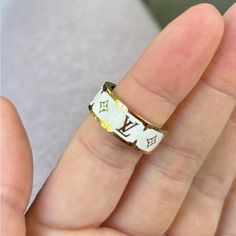 Louis Vuitton Nanogram Enamel Ring White Size Medium Mint Condition Designer White Jewelry For Everyday Luxury, Designer White Jewelry For Everyday Wear, Designer White Rings For Gifts, White Luxury Enamel Wedding Ring, Elegant White Enamel Rings, Luxury Enamel Ring, Elegant White Oval Enamel Ring, Luxury White Enamel Ring, Adjustable White Enamel Ring