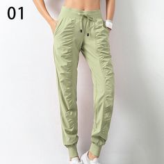 Look stylish and stay comfortable with these Women's Drawstring Workout Pants with Pockets. Crafted from a polyester blended material, these pants feature a pleated design, medium stretch, and a loose fit for maximum comfort. Choose from 7 different colors to find the perfect fit for you. These pants are perfect for any season and any occasion. With a high waist and straight pant style, you'll look great and feel great. The drawstring and pockets add a stylish touch to the pants, making them per Solid Color Joggers With Elastic Waistband, Stretch Pants With Drawstring For Leisure, Comfort Stretch Nylon Bottoms With Pockets, Casual Stretch Yoga Pants With Drawstring, Solid Activewear Trousers With Elastic Waistband, Solid Color Long Pants Activewear With Drawstring, Solid Color Activewear With Drawstring Long Pants, Stretch Solid Color Harem Pants For Leisure, Solid Stretch Harem Pants For Leisure