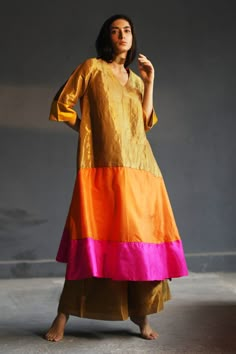 Multi-color A-line flared kurta with colorblock panels and placement hand embroidery.
Component: 1
Embroidered
Neckline: V Neck
Sleeve Length: Three Quarter
Fabric: Handloom Tissue, Silk
Color: Multi Color
Panelled kurta
Note: Dupatta and pant worn by the model is not for sale - Aza Fashions Tissue Dresses, Tissue Kurta, Gold Suit, Kurta Pant Set, Kurta For Women, Simple Kurta Designs, Silk Kurta, Embroidered Neckline, Straight Kurta