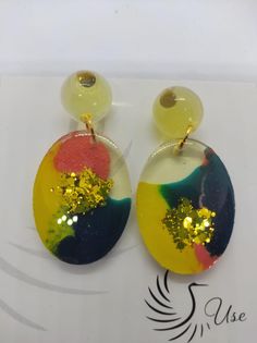 the earrings are painted with yellow and blue