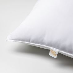 a white pillow with a tag on it