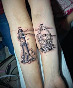 two people with tattoos on their arms are standing next to each other, one has a lighthouse and the other has a ship