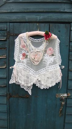 Gorgeous romantic pretty white lace layering top. This has an oversized look and could fit a few sizes depending on how loose you may want to wear it.. This beauty has been reworked and features a wide scooped neckline and exaggerated wide cap sleeves. This has a white sheer base and I have added vintage style appliques to the front and back; cherubs and florals. At the hemline, various vintage mats and doilies have been added, including a "Brugges" lace mat. This has an uneven hemline with ligh Lace Layering Top, Lace Diy Projects, Layered Lace Top, Top Layering, Lace Diy, Lace Doily, Scooped Neckline, Lace Doilies, Layered Tops