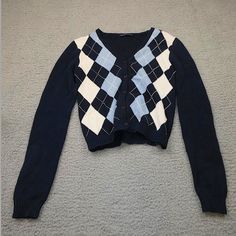 This Is A Brandy Melville Cardigan/Sweater. It Has A Blue White And Navy Argyle Design. I've Only Worn This Once To A Birthday Party But Other Than That Is It Unused. Trendy Navy Sweater For Fall, Preppy Black Top For Fall, Trendy Navy Sweater For Winter, Preppy Cotton Sweater For Winter, Preppy Long Sleeve Fall Sweater, Preppy Long Sleeve Cotton Cardigan, Preppy Cotton Winter Tops, Preppy Cotton Cardigan With Long Sleeves, Preppy Cotton Tops For Winter