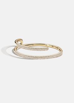 —The Crescendo Collection Crafted of solid 18K gold, the Mono Pavé Bracelet features bold lines that cascade around the wrist in new and unexpected directions. Approx 0.80tcw / 38.2 grams Diamond Grade: F/G color, VS clarity 2.25 " in length Available in Yellow Gold -Handmade in Los Angeles, California. Luxury Yellow Gold Open Band Bracelet, Luxury Open Band Bracelets For Formal Occasions, Luxury Open Band Bracelet For Formal Occasions, Yellow Gold Open Band Bracelets For Formal Occasions, Yellow Gold Open Band Bracelet For Formal Occasions, Formal Yellow Gold Bangle With Modern Twist, Gold Jewelry With Brilliant Cut In Modern Style, Formal Yellow Gold Open Band Bracelet, Modern 14k Gold Bracelet With Brilliant Cut