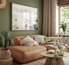 a living room filled with furniture and plants on top of a table in front of a window