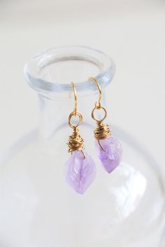 Handmade dainty raw amethyst earrings in 18k gold plated.  This listing is for a pair of earrings. Gemstone size: about 13-15mm Earrings size: total about 30mm length Metal Component: Brass made 18k gold plated ﹎﹎﹎﹎﹎﹎﹎﹎﹎﹎﹎﹎﹎﹎﹎﹎﹎﹎﹎﹎﹎﹎ ▲ Care instruction:  Please remove it before bathing or swimming.  Avoid your jewelry touching chemical such as hairsprays or perfumes.  Using soft cloth to clean your jewelry every time after wearing it, and store it in a dry and cool place. ▲ Gift packaging:  All Handmade Amethyst Crystal Earrings In Gold, Gold Amethyst Drop Earrings, Amethyst Wire Wrapped Crystal Earrings As Gift, Gold Amethyst Earrings With Ear Wire, Gold Amethyst Crystal Earrings With Gemstone, Gold Amethyst Gemstone Crystal Earrings, Gold Amethyst Crystal Earrings, Gold Amethyst Dainty Earrings, Dainty Gold Amethyst Earrings