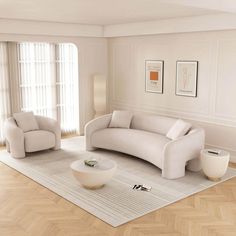 a white living room with two couches and a coffee table in the center area