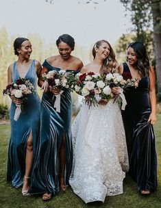 the bridesmaids are all dressed in different dresses and bouquets for their wedding