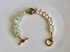 Beautiful jade and freshwater pearl beaded bracelet with toggle closure, good for both daily life and formal occasions. Looks expensive.  Usually ships within 1-2 business days,.  Thanks for purchasing. Elegant Jade Beaded Bracelets For Gift, Elegant Jade Bracelets For Wedding, Elegant Pearl Bracelet With Gemstone Beads For Wedding, Elegant Green Pearl Bracelet With Natural Stones, Elegant Green Jade Pearl Bracelet, Elegant Green Jade Bracelet, Elegant Green Pearl Bracelet, Elegant Jade Pearl Bracelet For Gift, Elegant Pearl Bracelet With Gemstone Beads