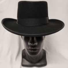 Excellent Quality Low Crowned Wool Felt With Satin Band. Brim: 3" Height: 4.5" Size: S, M, L, Xl 2xl Color: Black Size Guide: American / Nearest 1/8 Inch / Metric Cm / Size Code 6 3/4 21 1/8 54 Small 6 7/8 21 1/2 55 Small / Child L 7 21 7/8 56 Medium 7 1/8 22 1/4 57 Medium 7 1/4 22 5/8 58 Large 7 3/8 23 59 Large 7 1/2 23 1/2 Classic High Crown Top Hat For Country Events, Classic High Crown Fedora For Country Events, Classic Fedora Costume Hat For Winter, Classic Wide Brim Winter Costume Hats And Headpieces, Classic Wide Brim Winter Costume Hat, Classic Winter Fedora Mini Hat, Black High Crown Felt Hat With Adjustable Fit, Black Hat Bands For Kentucky Derby With Curved Brim, High Crown Hats For Winter Rodeo