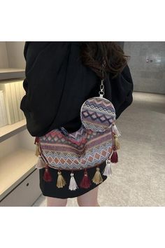 This printed crossbody bag is designed for women and comes with a small purse for added convenience. The tassel detail adds a touch of style, while the bag itself is perfect for everyday use. Stay organized and stylish with this versatile bag. Bag size: Medium Material: Polyester Imported Product measurements:11.4*4.3*8 in Trendy Shoulder Bag With Tassels, Trendy Hobo Bag Tote With Tassels, Trendy Everyday Shoulder Bag With Tassels, Travel Crossbody Shoulder Bag With Tassels, Trendy Everyday Hobo Bag With Tassels, Trendy Everyday Bag With Tassels, Daily Use Crossbody Shoulder Bag With Tassels, Trendy Bags With Tassels For Daily Use, Crossbody Shoulder Bag With Tassels For Daily Use