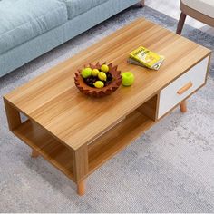 a coffee table with some fruit on it