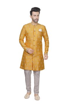 Sunlit joy radiates from this sunshine yellow kurta, where delicate white thread and sequin embroidery bloom like flowers in a sun-kissed garden. Intricate floral patterns dance across the fabric, shimmering like dewdrops on a bright morning. The sequins sparkle, casting a warm glow, evoking the happiness of a cloudless day. This vibrant ensemble weaves a tale of optimistic charm and radiant elegance. * Pre stitched kurta pyjama set for special occasions. * Tailored in premium quality silk fabric. * Full sleeved kurta comes with a complementing straight pants. * Adorned with mandarin collar and sequins. * Dry clean only to maintain colour and quality.    Note: Colors may slightly vary due to photographic lighting.    Please contact us if you have any questions via email, social media, text Designer Yellow Bandhgala Straight Kurta, Yellow Designer Wear Sherwani Straight Kurta, Spring Sherwani With Resham Embroidery, Straight Kurta Style, Gold Sherwani With Chikankari Embroidery, Designer Yellow Kurta For Spring, Gold Traditional Wear Straight Kurta With Floral Embroidery, Spring Sherwani With Intricate Embroidery And Traditional Drape, Designer Yellow Sherwani For Eid, Gold Bandhgala With Chikankari Embroidery For Diwali