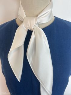 "Plain white natural mulberry silk medium square scarf, size: 65 cm x 65 cm / 26 in x 26 in. Soft, smooth, and lustrous silk charmeuse fabric, breathable and skin-friendly feels very soft and comfortable to wear. Can wear it on both sides which will give different feel and look. Can style in many ways: can wear this scarf as a soft neck scarf, as a hair tie, as a headband scarf, as a wrist scarf, as a purse accessory. Or style it in any way you want with your own sense of creativity! Suitable for all seasons and is a great gift idea for special occasions.  Care Instructions: Pure silk is a type of organic, natural and delicate fabric, please avoid washing if it's not particularly dirty. Gently hand wash cold/lukewarm with mild detergent, natural air dry. Stored in a cool, dry, and dark pla Elegant White Square Scarf, Elegant White Rectangular Scarves, Elegant White Square Silk Scarf, White Square Scarf For Summer, Elegant Spring Square Silk Scarf, White Square Silk Scarf As Gift, White Square Silk Scarf For Spring, Elegant Rectangular Silk Scarf For Spring, White Square Scarf For Spring