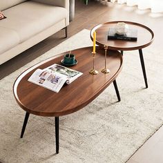 two coffee tables sitting on top of a white rug