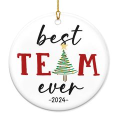 a white ornament with the words best team ever and a christmas tree on it