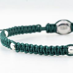 "Experience the understated sophistication of our handmade bracelet, where the refined art of macrame meets the luster of 925 sterling silver. Our thin green parachute rope macrame braided bracelet is a testament to the beauty of minimalist jewelry. Its slender profile and handcrafted charm embody a trend-setting yet timeless appeal, ensuring it becomes an indispensable part of your collection. FEATURED: * Elegant thin green parachute rope macrame braid * Minimalist and timeless style, perfect f Macrame Braid, Rope Macrame, Braid Jewelry, Braided Bracelet, Macrame Bracelet, Thanksgiving Gift, Bracelet For Men, Macrame Bracelets, Jewelry Bracelet