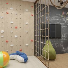 a child's play room with climbing walls and balls