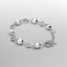 If it's not the real deal, it's not CRAFTD. Hand-strung with the finest freshwater pearls, this bracelet showcases each pearl encased in intricate filigree silver caps. Signature silver clovers, each adorned with 32 individually set AAA grade cubic zirconia stones, perfectly balance the design—offering the highest qual Elegant Metal Bracelets With Pearl Drop, Elegant Pearl Bracelets With Sterling Silver Clasp, Silver Sterling Bracelets With Pearl Chain, Elegant Beaded Metal Bracelets With Pearl Charm, Sterling Silver Bracelets With Pearl Chain, Elegant Silver Beads Bracelet, Formal Silver Beaded Bracelets With Pearl Drop, Elegant Pearl Bracelet With Silver Beads For Wedding, Elegant Silver Pearl Bracelets