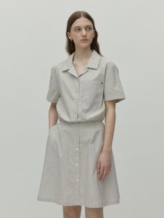 This is a modern and trendy shirt dress by DEPOUND that is made out of high quality cotton 100% fabric. With unique design detail and trendy mood, it will stand out from your casual daily outfit. - Classic mood eiwht open collar- High quality sea shell buttons- Lining in the skirt - Side pockets detail- Metal logo engraved charm Casual Beige Short Sleeve Shirt Dress, Beige Casual Shirt Dress With Short Sleeves, Beige Short Sleeve Shirt Dress, Beige Button-up Cotton Dress, Neutral Cotton Short Sleeve Dress, Beige Short Sleeve Shirt Dress With Pockets, Beige Cotton Shirt Dress For Daywear, Collared Beige Cotton Shirt Dress, Casual Beige Shirt Dress With Relaxed Fit