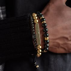 Chase your luck with the Vegas bracelet stack! The Vegas stack features trifecta of beaded beauties - black onyx, golden glitz, and rhodium PVD for a triple threat of style. Plus, a lucky dice and CZ bar for a dash of extra luck. Indulging the adventurous spirit and wandering heart that lives within all of us, our men's bracelet stacks have been crafted to provide a touch of class to your wardrobe throughout the year. Each exquistely curated stack includes a mix of spiritually healing gemstones Adjustable Gold Onyx Bracelet, Adjustable Gold Onyx Bracelets, Luxury Stackable Beaded Bangle Bracelets, Black Luxury Stackable Jewelry, Luxury Black Stackable Jewelry, Luxury Adjustable Stackable Gold Bracelet, Luxury Gold Beaded Bracelets For Gift, Adjustable Black Bracelets With Gold Beads, Adjustable Black Tennis Bracelet As Gift