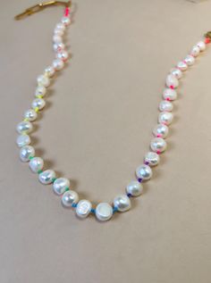 ✨7-8 mm Chunky Freshwater pearls ✨Colorful Neon Thread  ✨Gold Plated Clasp ✨Necklace Length: 15" + 2" extension 🧿 If you require a custom size send a message with your order 💫 Allow 1- 3 business days for the production before shipping. 💫 All jewelry comes in a cute pouch for storage. 💫 This product is handcrafted and shipped from Palm Beach, FL. ✨To view my entire collection please visit my ETSY SHOP✨ https://lunnajewelryfl.etsy.com Multicolor Beaded Necklaces With Pearl Drop, Multicolor Beaded Necklace With Pearl Drop, Multicolor Pearl Drop Necklace, White Beaded Necklaces With Round Beads For Birthday, White Beaded Necklaces For Birthday, White Beaded Necklace For Birthday, Multicolor Pearl Necklace With Pendant, Multicolor Pearl Drop Beaded Necklace, White Necklaces With Colorful Beads For Birthday