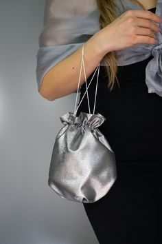 Elegant satin bag / money bag / purse ! Ideal for your wedding day, night out, party ,special occasion Made of beautiful silver grey bridal taffeta fabric. You can change colors Fabric : taffeta Lining : poliester Size : approx. 18 cm x 18 cm Elegant Metallic Bag For Gift, Elegant Metallic Bag As Gift, Elegant Metallic Bags For Gifts, Silver Pouch Evening Bag As Gift, Silver Pouch Bag For Gift, Silver Pouch Evening Bag For Events, Silver Clutch Evening Bag As A Gift, Silver Clutch Evening Bag Perfect As A Gift, Elegant Gray Pouch Bag