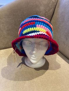 "hand made crocheted bucket/sun hat Size: 24\"-27\" Typical head circumference sizes: 21\" Xsmall 22\" Xs/Small 23\" Small/Medium 24\" Medium/Large 25\" Large/XL Material: 100% acrylic Wearable  Foldable for your purse  One of a kind hat Head Size in Inches Head Size in Centimeters American Hat Sizes   Head Size in Inches                          Head Size in Centimeters                            American Hat Sizes 19 3/8\"                                                 49.2 cm Knitted Adjustable Bucket Hat For Vacation, Knitted Beach Hat Made Of Yarn, Adjustable Knitted Bucket Hat For Vacation, Multicolor Brimmed Crochet Hat, Knitted Short Brim Bucket Hat For Beach, Knitted Bucket Hat For The Beach, Adjustable Knitted Bucket Hat For Beach, Adjustable Crochet Wide Brim Hat, Crochet Hat With Short Brim For Vacation