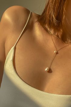 Warm glow on our Elle lariat necklace featuring gold filled chain with freshwater pearls — can wear it in the shower? Check! Pearl Lariat Clavicle Necklace, Pearl Lariat Clavicle Chain Necklace, Pearl Clavicle Chain Lariat Necklace, Pearl Lariat Necklace With Delicate Chain, Pearl White Chain Necklace Gift, Adjustable Chic Pearl Necklace, White Pearl Lariat Necklace With Clavicle Chain, Double Strand Pearl Pendant Chain Necklace, Chic Adjustable Pearl Necklace