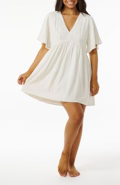 Subtle floral embroidery at the bodice and a swingy skirt let you move from daytime to dinner in this breezy all-cotton dress. V-neck Short sleeve Unlined 100% cotton Machine wash, line dry Imported Flowy V-neck Sundress With Lace Trim, A-line Dress With Lace Trim For Vacation, Flowy A-line Breezy Dress, Breezy Short Sleeve Dress For Brunch, Flowy Short Sleeve Feminine Sundress, Cotton Short Sleeve Sundress For Brunch, Flowy Cotton Mini Dress With Smocked Back, Summer Floral Embroidered Flutter Sleeve Dress, Cotton Short-sleeved Sundress For Brunch