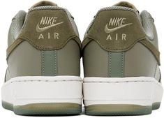 Nike.Green Air Force 1 '07 LV8 Sneakers.Low-top grained leather sneakers in green..· Perforated detailing at toe and sides.· Lace-up closure.· Logo patch at tongue.· Padded collar.· Suede Swoosh appliqué at sides.· Logo embroidered at heel tab.· Mesh lining.· Treaded rubber sole.Please note that this item may be shipped only within North America..Supplier color: Dark stucco/Medium olive.Upper: leather. Sole: rubber..Made in Viet Nam..241011M237113 Green Nike Air Force 1 With Round Toe, Green Leather Nike Air Force 1 With Round Toe, Casual Green Sneakers With Embossed Logo, Nike Air Force 1 Green With Gum Sole, Nike Air Force 1 Green Round Toe, Green Nike Air Force 1 With Gum Sole, Nike Air Force 1 With Embossed Logo For Sports, Green Nike Air Force 1 With Cushioned Footbed, Nike Air Force 1 Sports Leather With Embossed Logo