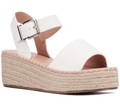 Elevate your summer style with the Elandra. These sandals blend the classic charm of espadrilles with a modern silhouette, finished with polished buckles for a touch of elegance. Perfect for sunny days and balmy nights, they're a versatile addition to any wardrobe. From New York & Company. Summer Espadrille Sandals For Day Out, White Espadrilles With Removable Insole For Summer, White Espadrille Sandals For Summer, Summer Wedge Sandals With Buckle Closure For Day Out, Summer Wedge Sandals With Buckle For Day Out, Modern Wedge Sandals For Spring Vacation, Trendy White Espadrilles For Summer, Modern Wedge Sandals With Buckle For The Beach, Modern Beach Wedge Sandals With Buckle Closure