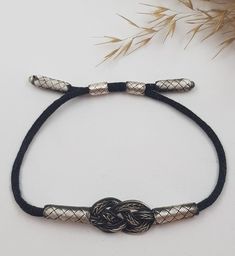 This Anthracite Unisex Bracelet with Colourful Silk Cord is braided from 1000 Carat Silver. This is a special technique known as 'KAZAZ' or 'KAZAZİYE' . First we make  threads from silver and then we knit them ONE by ONE on hand by using ancient Lydian techniques. Personalized Gift, Friendship Bracelets, 18th Birthday Gift It will be shipped in a giftbox ready to give.    Type: Kazaziye Sterling Silver Bracelet For Unisex Metal: 1000 Sterling Silver( only lock part is 925 sterling silver), Silver is oxidized to make grey Bracelets are made according to the size you choose.  Kazaziye products are pure 1000 carat silver and completely handcrafted. Since no welding process is performed, no setting is written on the casualty products. Therefore, there is no setting stamp on the casual products Silver Infinity Bracelets, Gray Bracelet, 18th Birthday Gifts, Mens Bracelet Silver, Silk Cord, Handmade Jewelry Gift, Unisex Bracelets, Sterling Silver Mens, Silver Art