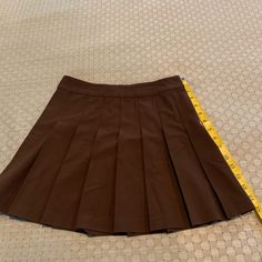 Never Worn Skirt Purchased From Aritzia. Tag Fell Off Brown Fitted Mini Pleated Skirt, Fitted Brown Pleated Tennis Skirt, Brown Stretch Pleated Bottoms, Stretch Brown Pleated Bottoms, Fitted School Uniform Skort, Fitted Brown Lined Tennis Skirt, Fitted Brown Tennis Skirt, Brown Pleated Tennis Skirt, Fitted Pleated School Skirt