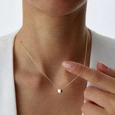 14K Solid Gold Little Gold Vermeil Cube Necklace Elevate your style with our 14K Solid Gold Little Gold Vermeil Cube Necklace - a dainty and minimalist piece that adds a touch of elegance to any outfit. This geometric necklace features a petite cube charm, expertly crafted from high-quality gold vermeil, offering a chic and timeless look. Details: Material: 14K Solid Gold Pendant: Gold Vermeil Cube Chain Length: Varies Style: Minimalist, Geometric, Dainty Perfect for layering or wearing alone, t Minimalist Jewelry With Square Pendant And Adjustable Chain, Minimalist 14k Gold Necklace With Adjustable Chain, Modern 14k Gold Square Pendant Jewelry, Modern 14k Gold Necklace For Everyday, Minimalist Jewelry With Delicate Chain And Square Pendant, Minimalist Jewelry With Delicate Square Pendant, Minimalist 14k Gold Necklace With Square Pendant, Minimalist 14k Gold Clavicle Chain Necklace, Modern 14k Gold Charm Necklace