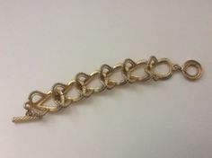 "Givenchy brushed gold, matte gold, satin gold twisted wire link bracelet Very good condition size - 7.5\" with clasp x 1\"" Adjustable Bronze Bracelets For Formal Occasions, Matte Gold Metal Bracelet, Elegant Bronze Bracelets For Wedding, Elegant Metal Bracelets With Gold Clasp, Adjustable Gold-tone Oval Link Bracelet, Elegant Metal Bracelet With Gold Clasp, Antique Gold Adjustable Bracelets For Formal Occasions, Elegant Adjustable Chain Bracelet With Gold Clasp, Elegant Antique Gold Metal Bracelets