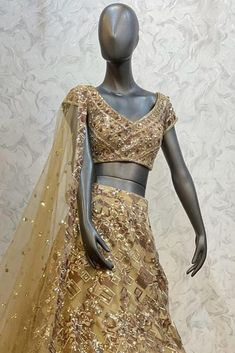 Description : This Lehenga Choli is Ready to Wear Golden attached cancan lehenga with sequin, floral embroidery. Paired with a padded blouse with all over beads, sequins, thread work and dupatta. Details : No of Components: 3 Components: Blouse, Dupatta, Lehenga Pattern: Embroidery Type of Work: Sequins, & Thread Work Neckline: Sweetheart Neck Sleeve Type: Sleeveless Fabric: Net Color: Golden Other Details: Attached inner lining Lehenga Length: 46.5 inches Blouse Chest : 36 Occasion: Bride, Dest Bollywood Sequin Fabric With Unstitched Blouse For Reception, Party Wear Embellished Choli For Diwali, Diwali Party Wear Embellished Choli, Navratri Embellished Organza Lehenga, Embellished Art Silk Set For Reception, Semi-stitched Embellished Chinon Choli, Festive Traditional Wear With Sequins For Reception, Fitted Embellished Sequin Fabric With Traditional Drape, Organza Traditional Wear With Sequins For Navratri