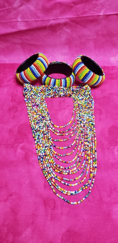 Beaded multi color chocker with hanging layers and a matching beaded closure. One size fits most. Maasai, Black Faux Leather, Doll Accessories, Multi Color, Bangles, Faux Leather, Necklaces, Dolls, Band