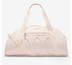 This spacious duffel bag from Nike is perfect for all your travel, casual, and work needs. The bag is made of 100% polyester exterior material and features a solid dusty pink pattern with silver, blush, light pink, baby pink, and rose character accents. It has a zip closure and comes with a detachable shoulder strap for added convenience. The bag is large in size, measuring 21 inches in width and 15 inches in height, and has a brown polyester lining. It also includes a pouch, coin purse, key holder, and detachable strap as accessories. The Nike One Club Women's Training Duffel Bag is a must-have for any sports enthusiast and is available for purchase now. Cheer Basketball, Nike Dance, Volleyball Bag, Basketball Bag, Tennis Bag, Nike Pro Leggings, Training Bags, Dance Bag, Essential Bag