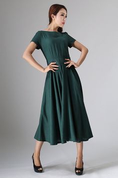 1950s Style Fit And Flare A-line Vintage Dress, Elegant Cotton A-line Vintage Dress, Solid Color A-line Retro Vintage Dress, Solid Color Retro A-line Vintage Dress, Retro Solid A-line Vintage Dress, Cotton A-line Dress With Box Pleat, Classic Green Cotton Dress, Solid Color Vintage Cotton Dress, Solid Color A-line Vintage Midi Dress