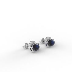 Dress up with these sophisticated pair of Sapphire earrings full of sparkle and chic`They look so perfectly beautiful it's instantly classic.- Made to Order, perfectly finished, Fast shipping fully insured and trackable online.- Sapphire information: Two 6x4mm oval cut Sapphire corundum 1.02 ctw- Diamond information: 6 x Diamonds, VS-E, 0.08 ctw- Arrives gift ready with a certificate of authenticity. Timeless Gemstone Earrings For Evening, Timeless Evening Earrings With Gemstone, Classic Diamond Cut Earrings For Evening, Classic Round Cut Evening Earrings, Classic Round Cut Earrings For Evening, Silver 14k Gold Earrings For Everyday Luxury, Elegant 14k Gold Round Cut Earrings, Refined Drop Earrings For Anniversary, Elegant Cubic Zirconia Gemstone Earrings