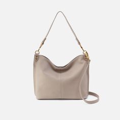 This bag pairs style and function effortlessly, converting from a shoulder bag to crossbody for two looks in one. Pier Shoulder Bag in Pebbled Leather  Taupe SHOULDER in Taupe | Hobo® Everyday Shoulder Bag With Gold-tone Hardware, Everyday Hobo Shoulder Bag With Gold-tone Hardware, Chic Everyday Shoulder Bag With Textured Leather, Gold-tone Hardware Hobo Shoulder Bag, Modern Everyday Luxury Crossbody Shoulder Bag, Everyday Hobo Bag With Gold-tone Hardware And Double Handle, Everyday Crossbody Hobo Bag With Gold-tone Hardware, Modern Crossbody Hobo Bag With Gold-tone Hardware, Versatile Hobo Bag With Gold-tone Hardware For Daily Use