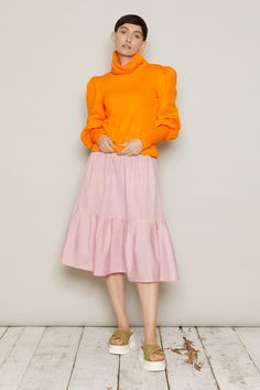 A floaty midi skirt with a deep, softly gathered hem, the Finndis skirt is easy to wear, with a pretty edgeTwo designs are available, in soft tones, evocative of Iceland’s flora: Rhubarb Pink or Dandelion Orange. Note the beautiful attention to detail in the design, thanks to the colour contrast pocketsThe elasticated waistband at the back gives a perfect fit. Ethically made in vegan, 100% cotton. Inclusive sizing, available in XS to 6XLEach skirt is numbered and production is limited to 100 pie Feminine Midi Length Bottoms With Ruffles, Flowy Ruffled Midi Maxi Skirt, Daywear Midi Skirt With Ruffles, Chic Ruffle Hem Skirt For Fall, Chic Fall Skirt With Ruffle Hem, Midi Skirt With Ruffles For Daywear, Midi Skirt With Ruffle Hem, Flowy Ruffled Midi Length Skirt, Feminine Ruffled Skirt For Fall