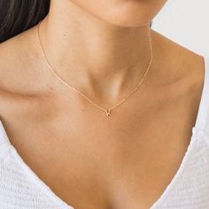 Tiny, dainty, and adorable, this Tiny Initial Necklace will be your new go-to. It's personalized just for you - wear your own initial or that of a special someone in your life. You can wear it everywhere - from your morning coffee run all the way to girl's night out. Yes - that includes the gym and the shower too! DETAILS Necklace length: 16" with 2" extender 14k gold vermeil -or- sterling silver charm - 5mm tall 14k gold filled -or- sterling silver chain, findings, & spring clasp Safe for sensi Dainty Gold Initial Necklace, Tiny Initial Necklace, Dainty Letter Necklace, Dainty Initial Necklace Gold, Initial Necklace Aesthetic, Initial Jewelry Necklace, K Necklace, J Necklace, Letter Charm Necklace