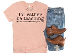 "Funny Teacher Shirts - Inservice Day T-Shirts for Teachers - I'd Rather Be Teaching Professional Development Shirt The Shirt ------ This premium t-shirt is soft and lightweight with just a little bit of stretch.  The unisex cut is flattering for both men and women as well as for a variety of body types.  Fit ------ Generally this shirt runs true-to-size, but if you're in between sizes or prefer your shirts roomier, size up! Please note that while the sizing says \"men's,\" this really is a unis Funny Teacher Shirts Zazzle, Teacher Break Shirt, Teacher's Outfits, Funny Teacher Shirts, Funny Teachers, Teacher Tee Shirts, School Attire, Class Shirts, Teacher Wardrobe