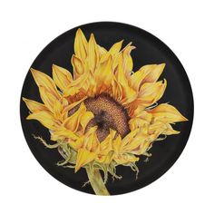 a drawing of a sunflower on a black plate